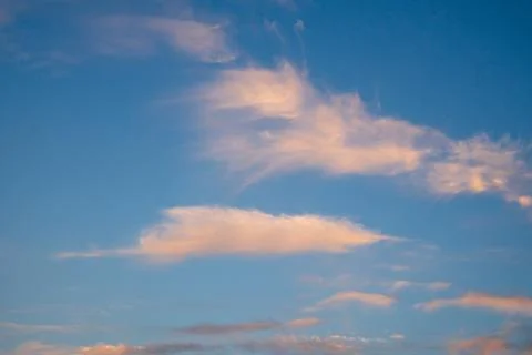 Vibrant blue sky with light clouds Stock Photos
