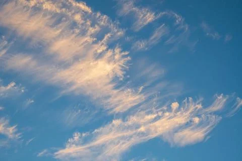 Vibrant blue sky with light clouds Stock Photos