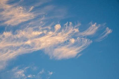 Vibrant blue sky with light clouds Stock Photos
