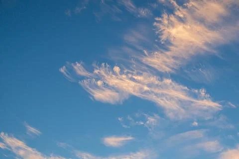 Vibrant blue sky with light clouds Stock Photos
