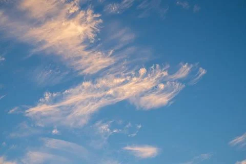 Vibrant blue sky with light clouds Stock Photos