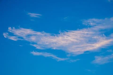 Vibrant blue sky with light clouds Stock Photos