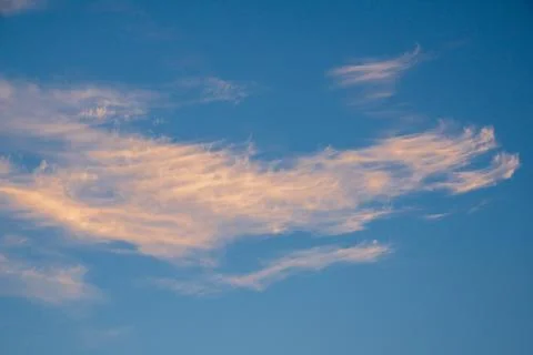 Vibrant blue sky with light clouds Stock Photos