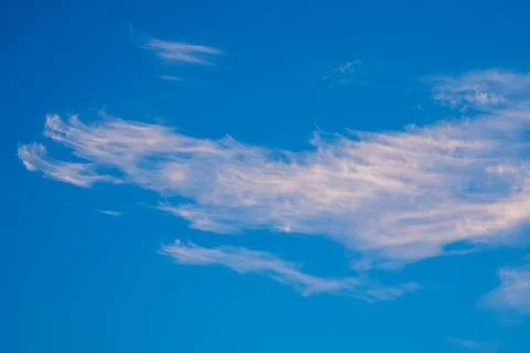 Vibrant blue sky with light clouds Stock Photos