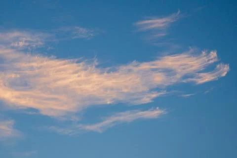 Vibrant blue sky with light clouds Stock Photos