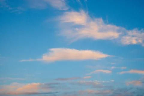 Vibrant blue sky with light clouds Stock Photos
