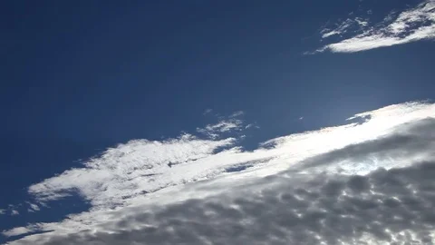 Vibrant blue sky with white clouds. Stockbeeldmateriaal 75373606