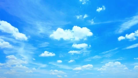Vibrant blue sky with white moving clouds and time lapse motion Stock Footage 332727728