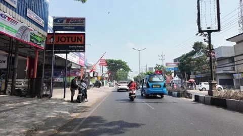 Vibrant blue van and a stream of motorbikes Stock Footage 345200529