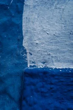 Vibrant blue wall texture: A captivating textured surface in striking blue,.. Stock Photos