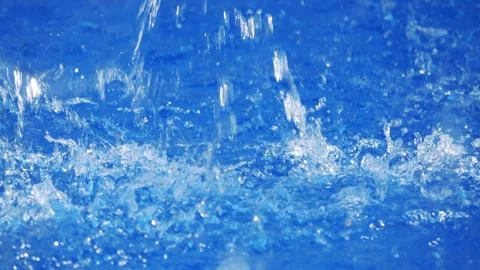Vibrant blue waves splashing dynamically in a water body in 4k slow motion .. Stock Footage 284219558