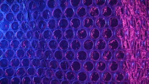 Vibrant Bubble Wrap Texture in Blue and Pink Light Stock Photos