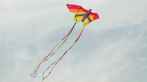 Vibrant Butterfly Kite Dancing High Against Cloudy Sky Video stock 339074305