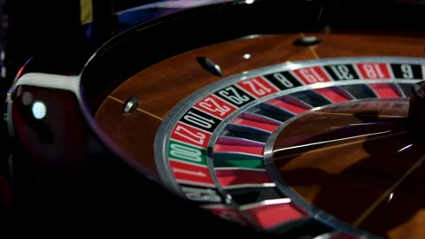 Vibrant casino table with roulette in motion, with casino chips, tokens, the 動画素材 302091761