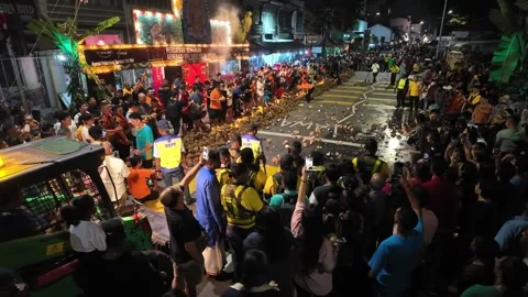 The vibrant chaos of broken coconuts marks Thaipusam intense devotion. 스톡 동영상 318098114