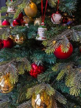 Vibrant Christmas tree features an array of colorful ornaments creating a joy 스톡 사진