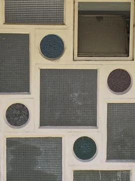 Vibrant Circle Inserts Arranged In Orderly Grid With Textured Surfaces And .. Foto stock