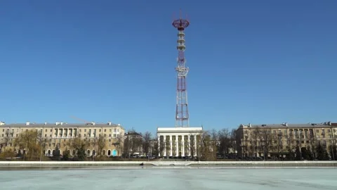 A vibrant cityscape showcases a striking communication tower alongside beautiful Stock Footage 344567352