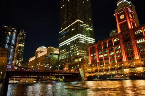 Vibrant clock tower and bridge at night in Chicago ship canals 写真素材