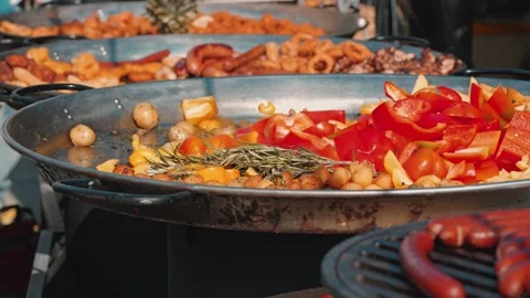 Vibrant close-up of grilled vegetables like red peppers and potatoes with Stock Footage 345499598