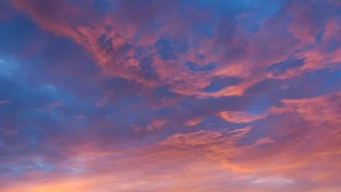 Vibrant clouds at sunset Stock Photos