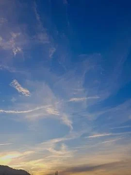 Vibrant cloudscape, where fluffy formations dance across the sky. The sunlight Stock Photos
