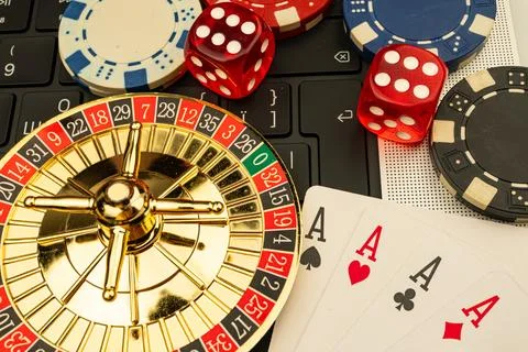 A vibrant collage featuring a spinning roulette wheel, scattered playing ca.. Stock Photos