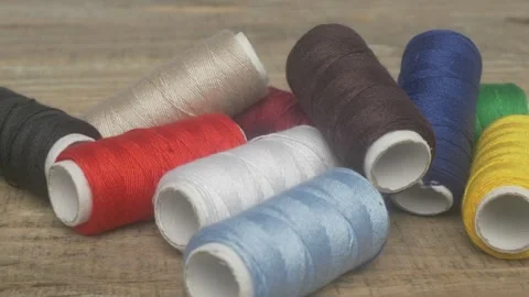 A Vibrant Collection of Colorful Spools of Thread for Your Various Sewing Stock Footage 287454632