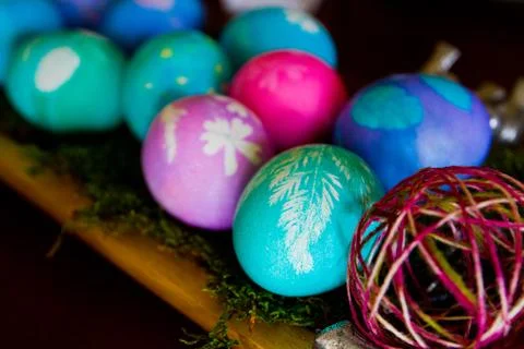 Vibrant Collection of Hand-Painted Easter Eggs on Wooden Surface Stock Photos