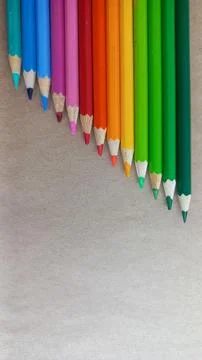 Vibrant Colored Pencils Arranged in Gradient Stock Photos