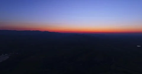 Vibrant Colored Sky High Altitude Flight Towards Mountain Range Aerial Video stock 289419323