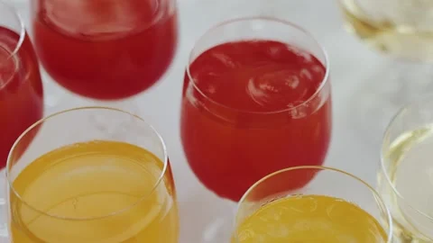 Vibrant, colorful drinks presented in stylish glasses, perfect for special Stock Footage 308397660