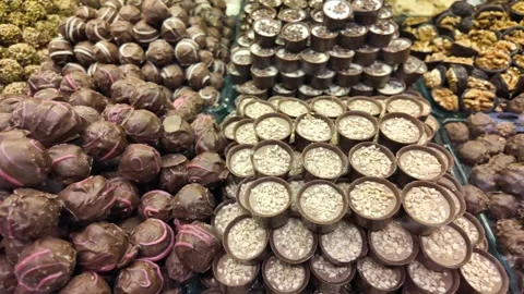 A vibrant confectionery display with an array of chocolates arranged artist.. Stock Footage 332097217
