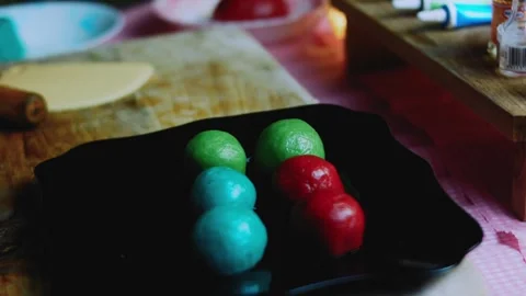 Vibrant cooking sequence of trimming a blue crown with a dough scraper Stock Footage 342155664