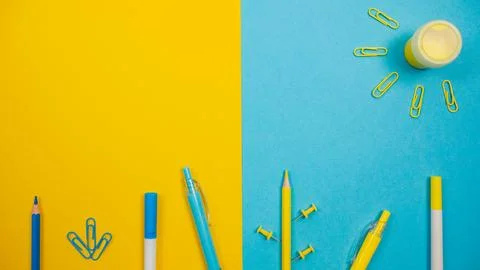 A vibrant, creative composition of office stationery items arranged Stock Photos