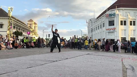 Vibrant dancers move in unison, adorned in golden Stock Footage 340142650