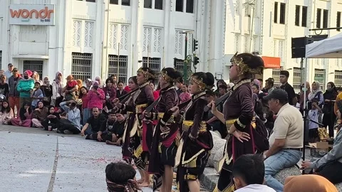 Vibrant dancers move in unison, adorned in golden, feathered costumes Stock Footage 340142717