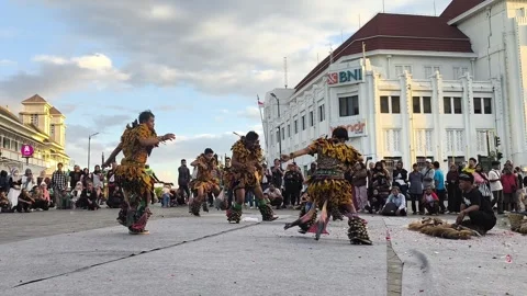 Vibrant dancers move in unison, adorned in golden, feathered costumes Stock Footage 340142978