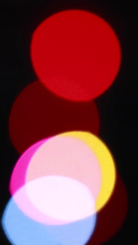 Vibrant Defocused Lights Flicker And Blur Against A Dark Background, Creating A  Stock Footage 322979317