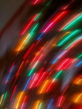 Vibrant Diagonal Light Streaks Creating an Abstract Christmas Neon Pattern 스톡 사진