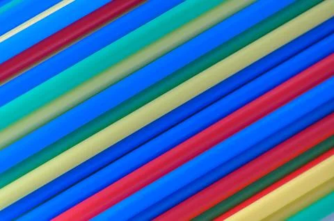 Vibrant Diagonal Pattern of Sorted Plastic Drinking Straws Stock Photos