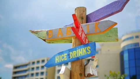 Vibrant direction signpost with arrows pointing to different destinations, .. Stock Footage 292985135