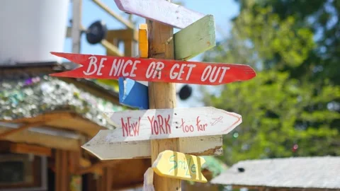 Vibrant direction signpost with arrows pointing to different destinations, .. Vídeos de archivo 292991499