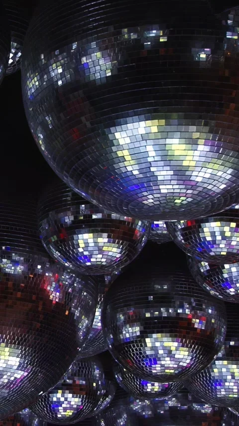 Vibrant Disco Ball Reflections for Neon Nightlife Visuals Stock Footage 299460749
