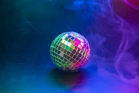 A vibrant disco image showcasing a disco ball amidst colorful, bubbly effec.. Stock Photos