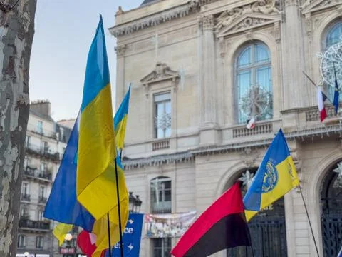 Vibrant display of flags celebrates unity and freedom in Paris Stock Photos