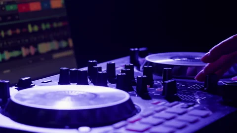 Vibrant DJ Mix Performance Closeup view of hands and equipment during a live Stock Footage 278557714