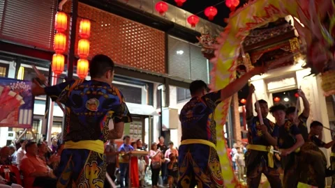 A vibrant dragon dance in full motion at a Chinese temple. Stock Footage 318100021