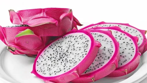 Vibrant dragon fruit showcasing its unique shape and colors on a minimalist Stock Footage 313330339