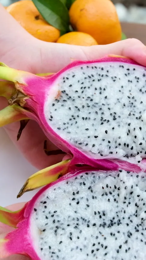 Vibrant dragon fruit sliced and arranged beautifully Stock Footage 310170012